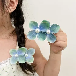 Pinza para bebé, flor de orquídea y perla en clip lateral elegante