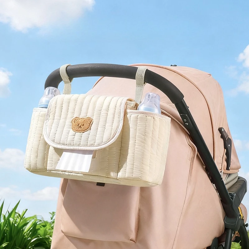 Organizador colgante para cochecito bordado, bolsa de pañales portátil de gran capacidad para mamá, bolso de viaje a la moda, bolsa para el cuidado del bebé manos libres