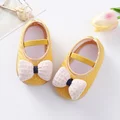 Yellow baby shoes