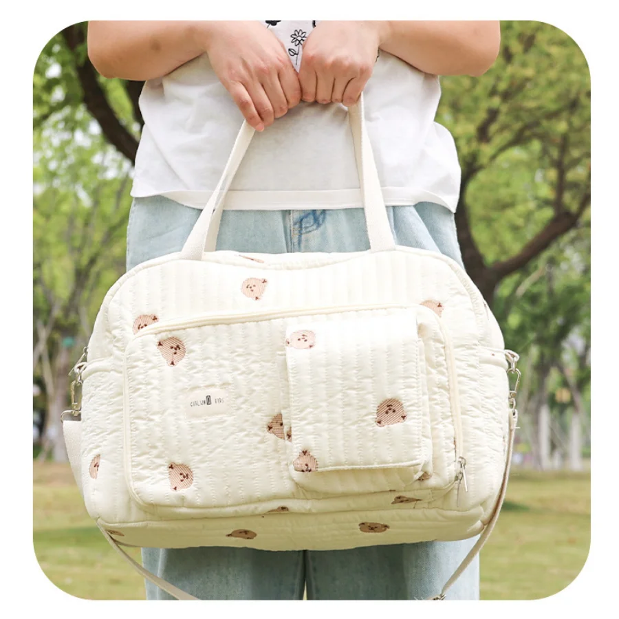 Bolso pañalera floral espaciosa con múltiples bolsillos
