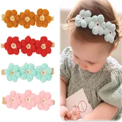 Diadema bebé lana con flores tejida artesanal
