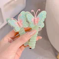 2 green butterflies