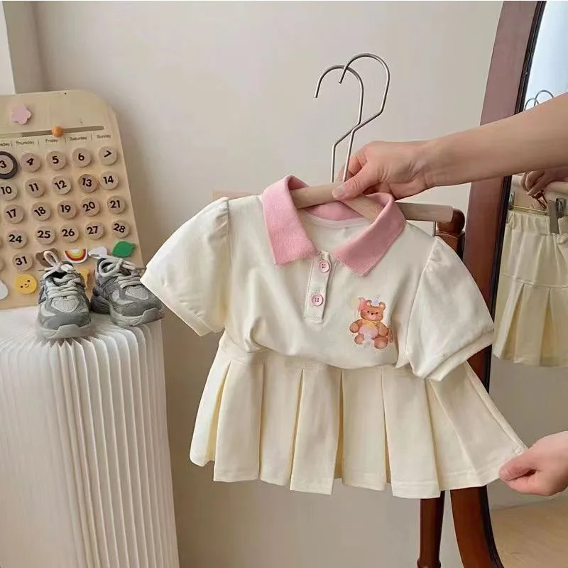 Conjunto niña verano top manga corta con solapa y falda ligera - imagen 3