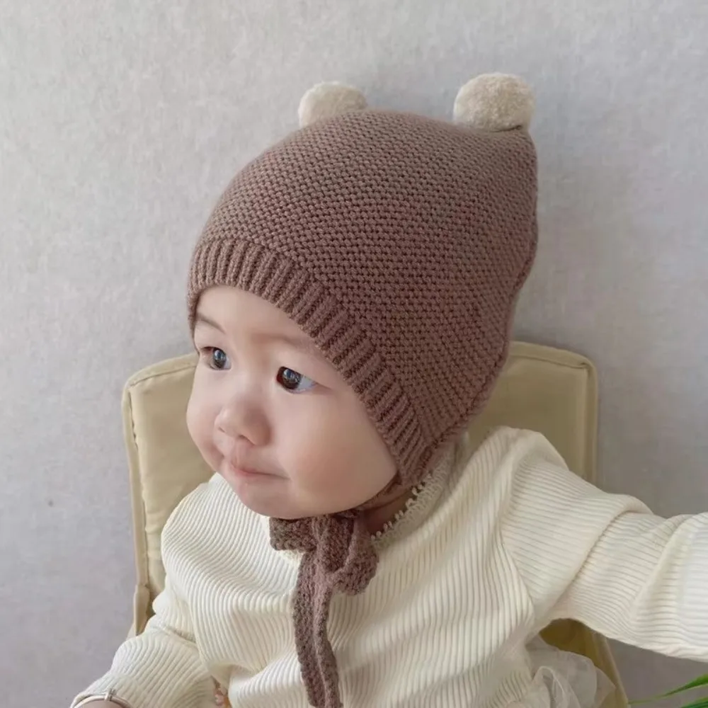 Nuevo Gorro coreano con protección para los oídos, gorro tejido cálido para invierno de 2 a 24 meses para niños pequeños, gorro infantil de ganchillo de lana con doble bola - imagen 3