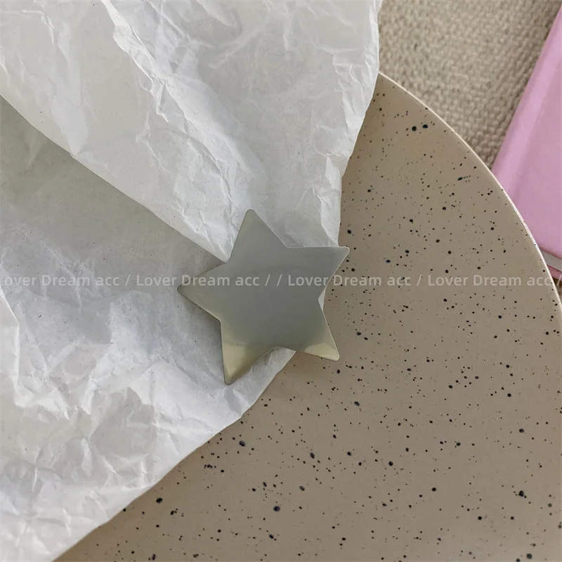 Pinza para el pelo estrella en gris y rosa para niñas