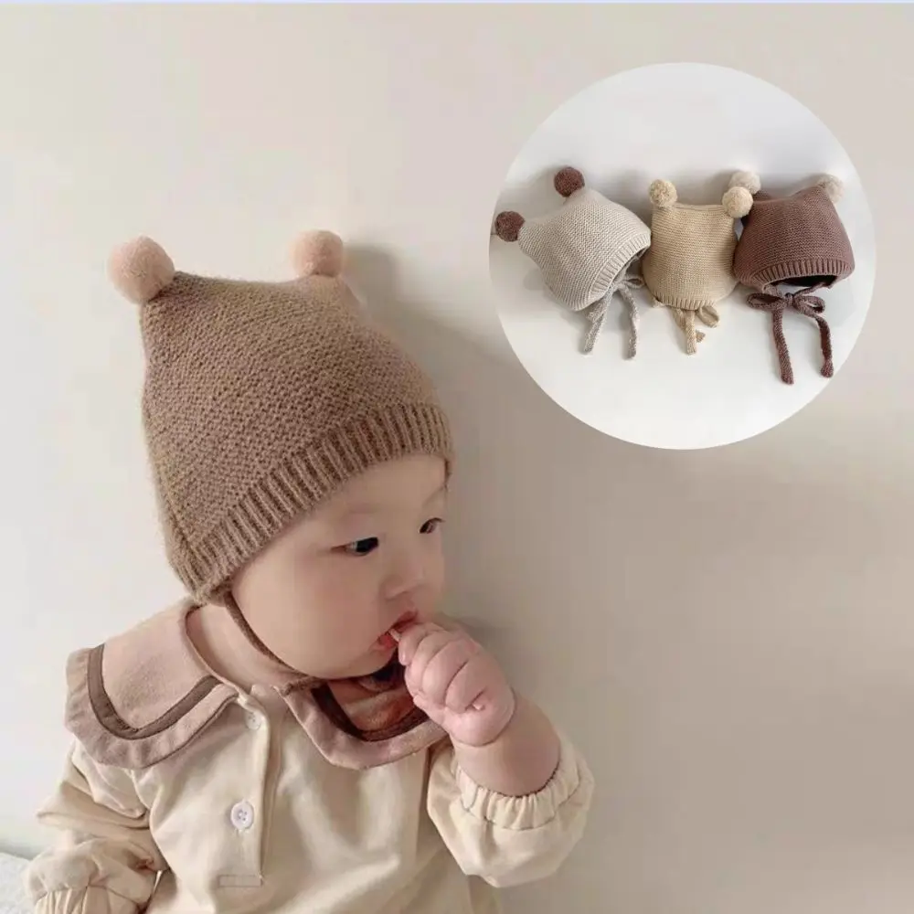 Nuevo Gorro coreano con protección para los oídos, gorro tejido cálido para invierno de 2 a 24 meses para niños pequeños, gorro infantil de ganchillo de lana con doble bola