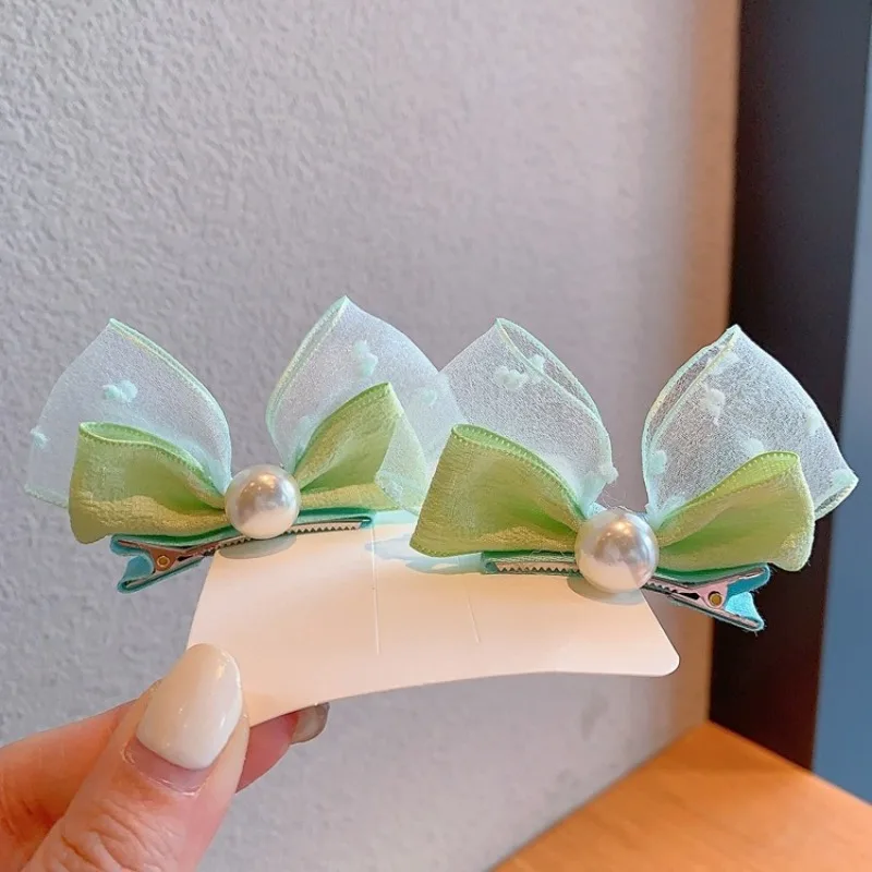 Pinzas con lazo de perlas y orejas de conejo para niñas - imagen 4