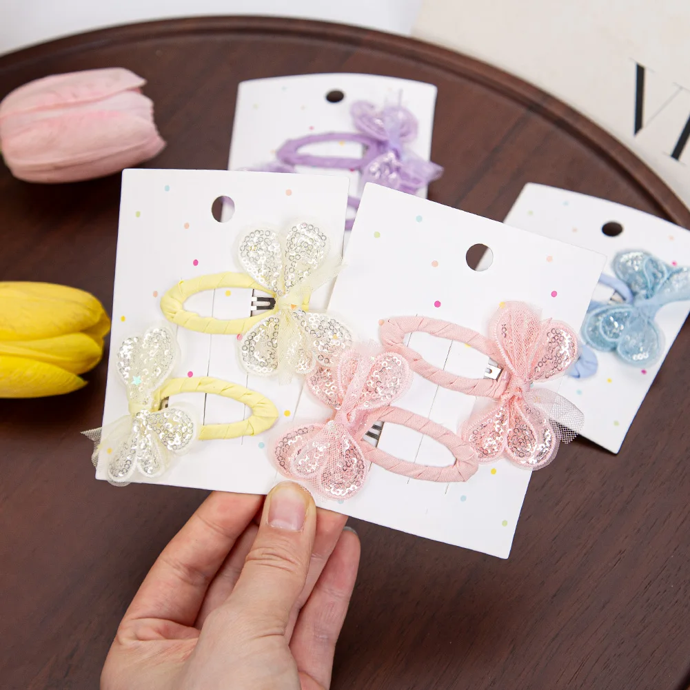 Pinzas de pelo con mariposa y lentejuelas para niña