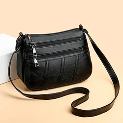 Bolso bandolera maternal de cuero suave con compartimentos