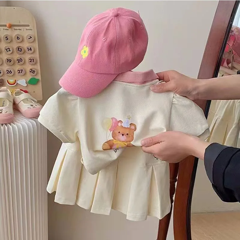 Conjunto niña verano top manga corta con solapa y falda ligera - imagen 5
