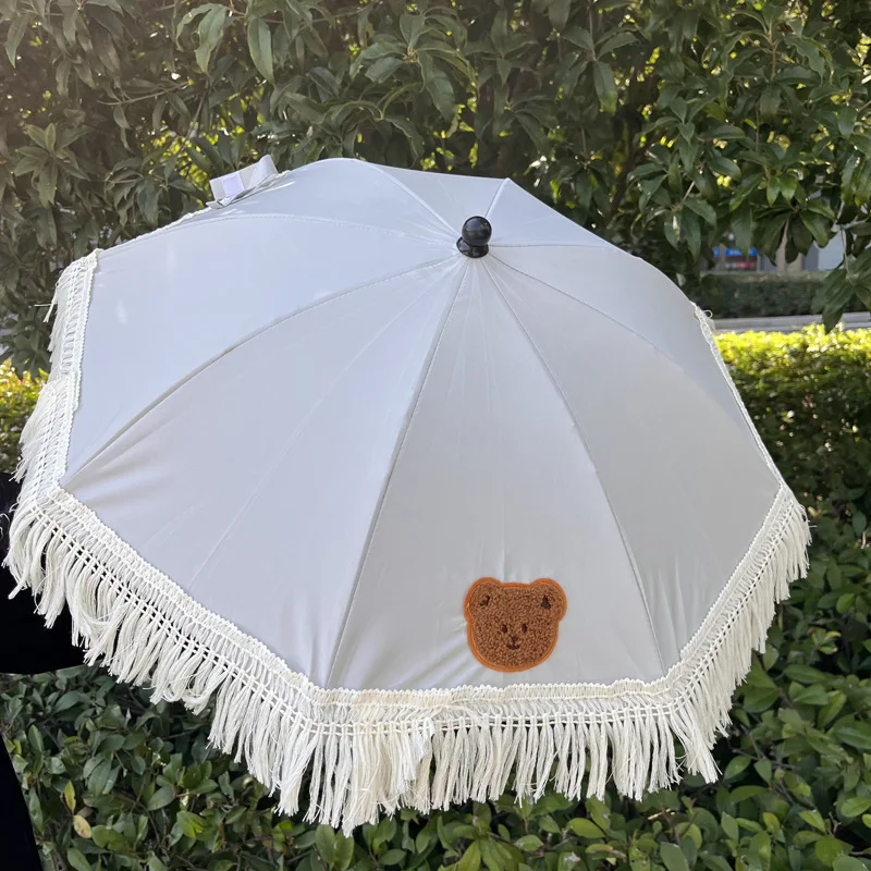 Parasol para cochecito impermeable con protección UV ajustable - imagen 2
