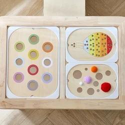 Mesa sensorial Montessori con bolas de madera