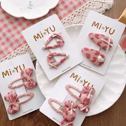 Pinza de pelo con lazo rosa y corazones para niña
