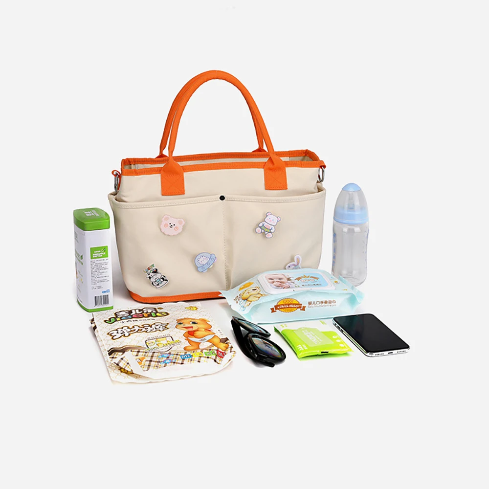 Bolsa de pañales Linda de lona ligera con bolsillo lateral