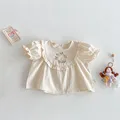 beige shirt