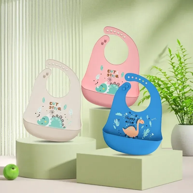 Baberos de silicona para bebé, babero impermeable con estampado de dinosaurio de dibujos animados, suave y ajustable, para alimentación de niño y niña