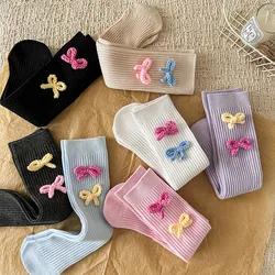 Calcetines de tubo para niña con lazo y rayas caramelo