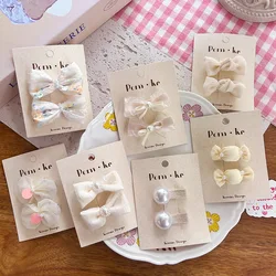 Pinzas de pelo niña princesa con lazo y perlas crema