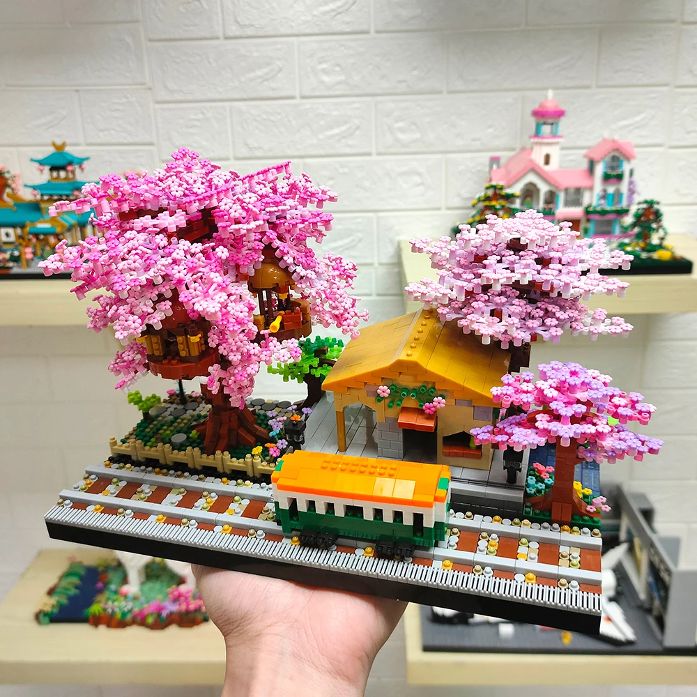 Casa de árbol de flores con bloques de construcción y luces - imagen 4