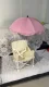 With pink umbrella