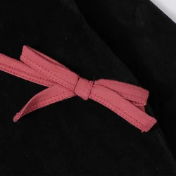 Vestido de velour negro para niña con cuello V y lazo contraste