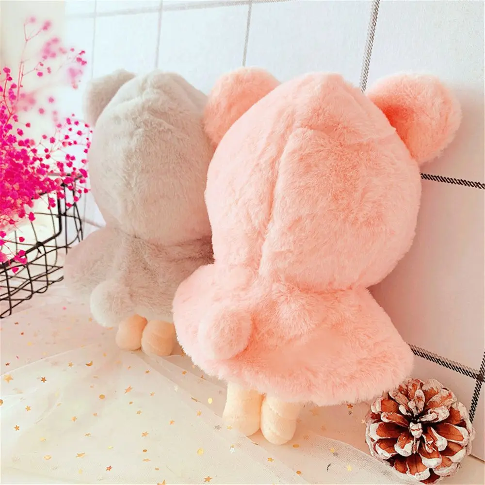 Capa puesta en muñeca de 15 cm