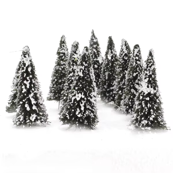 Árbol colocado junto a vía de tren en miniatura