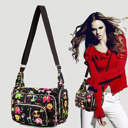 Bolso maternal bandolera de lona con estampado floral
