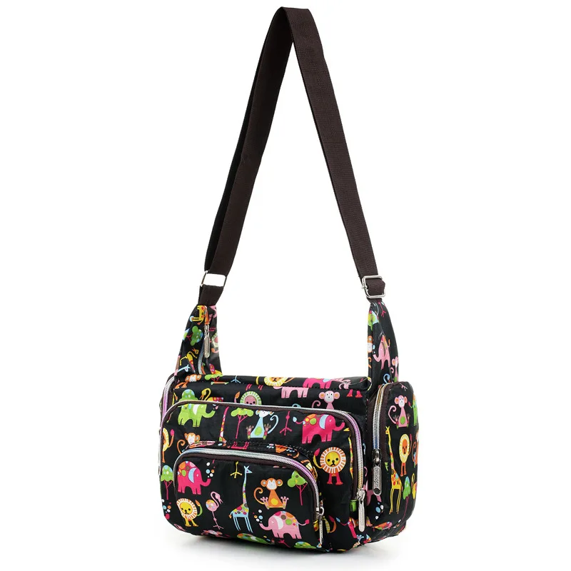 Bolso maternal bandolera de lona con estampado floral