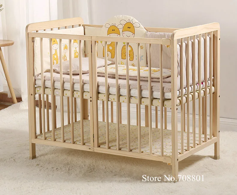 Cuna multifuncional de madera de pino con ruedas