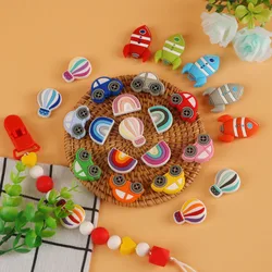 Cuentas de silicona forma cohete arcoíris para bisutería infantil