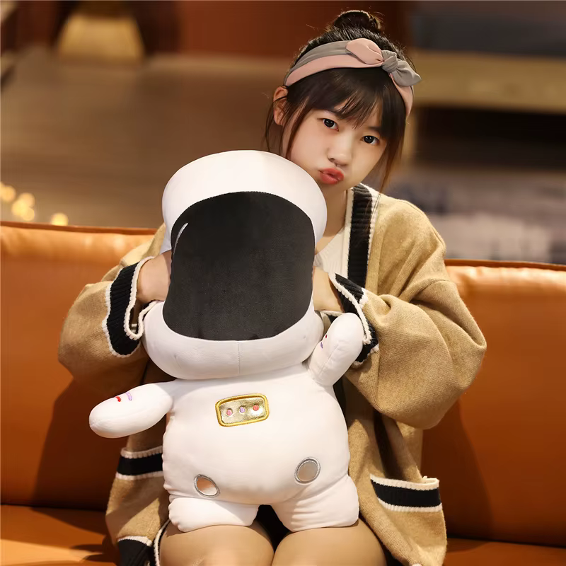 Peluche astronauta espacial en felpa con forma de nave para niños