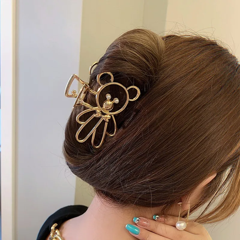Pinzas con forma de cangrejo y oso en acabado dorado