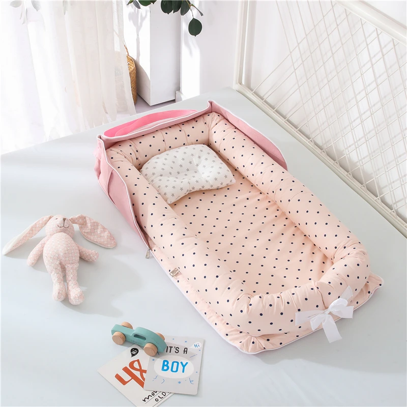 Cama nido portátil LazyChild con diseño ovalado en algodón suave