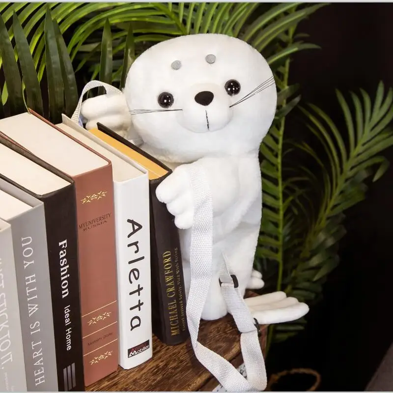 Mochila escolar de peluche suave para niños con diseño León marino