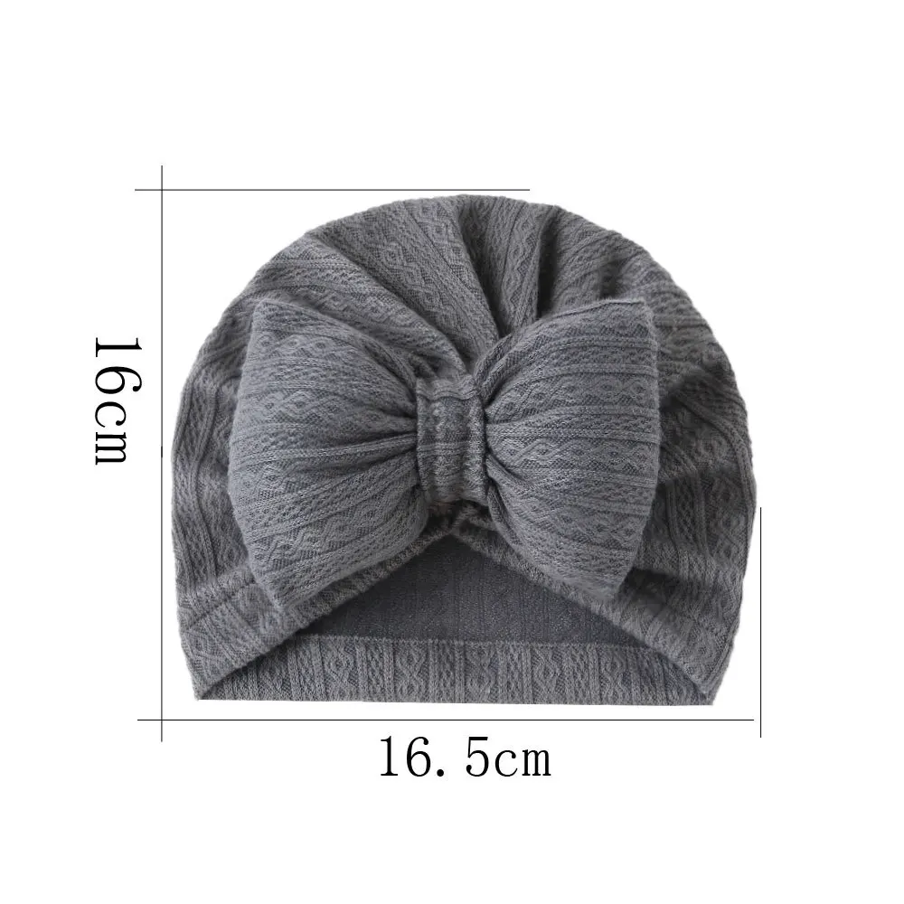 Gorro turbante en color claro para recién nacido