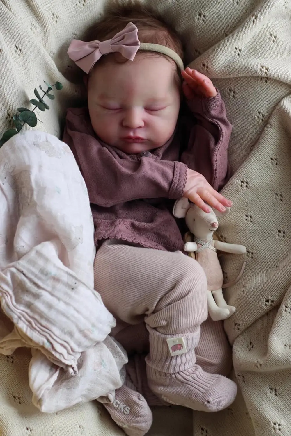 Muñeca NPK Laura con ropa de recién nacido