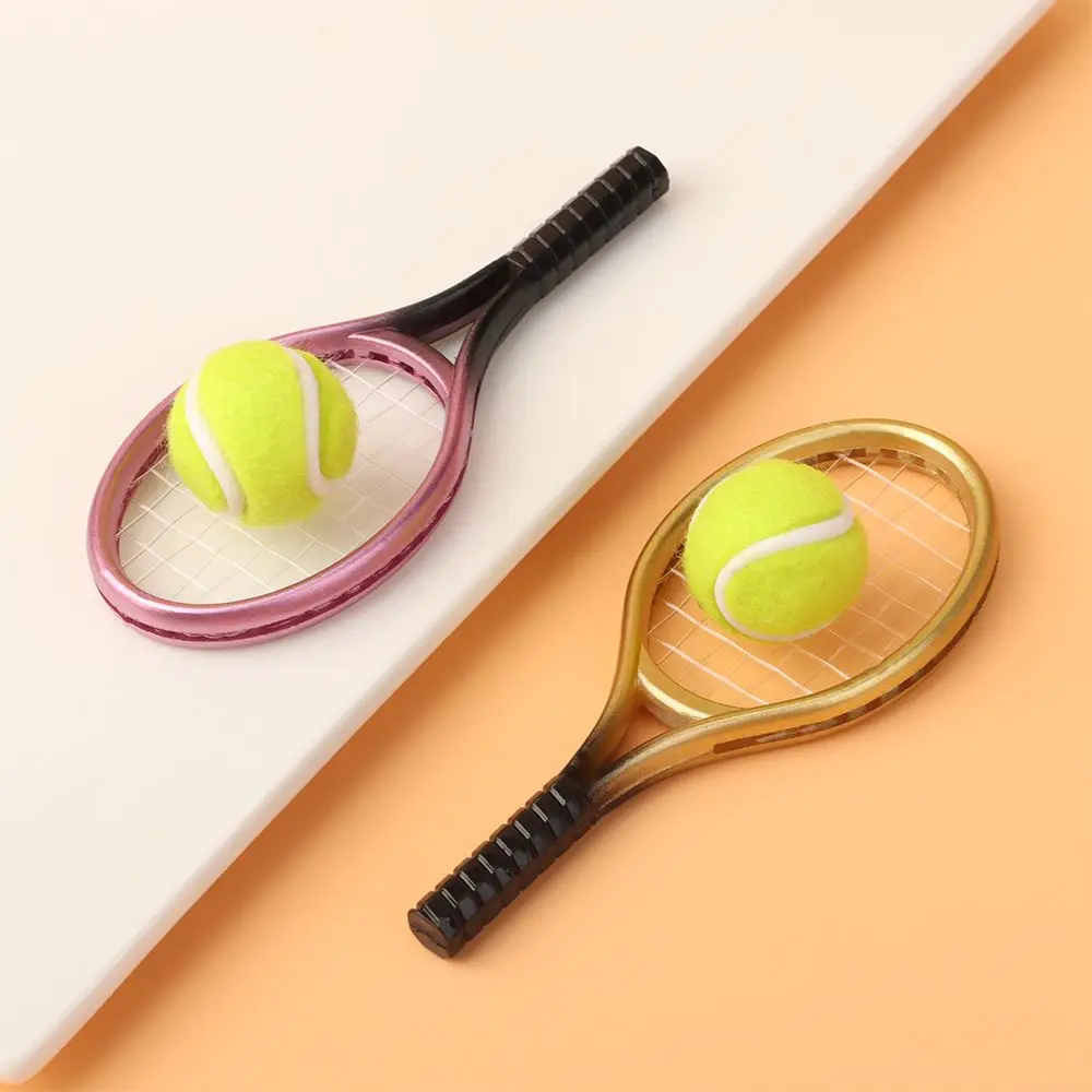Mini raqueta de tenis infantil para muñecas y juego de rol - imagen 2