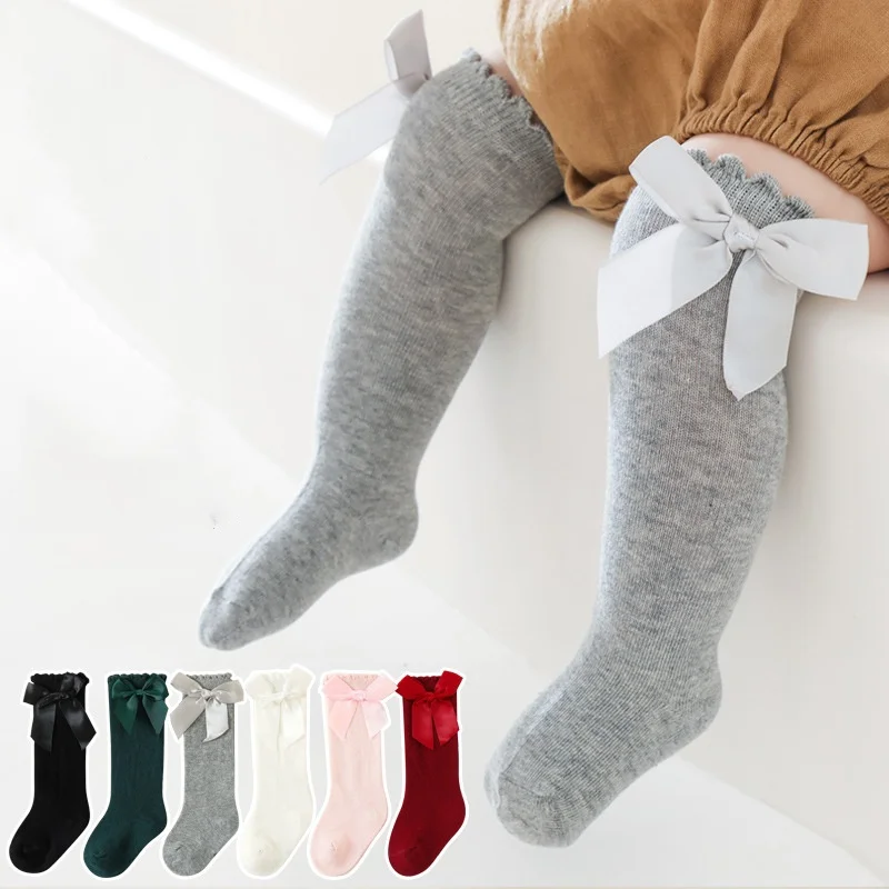 Calcetines hasta la rodilla bebé suaves de algodón con lazo elegante