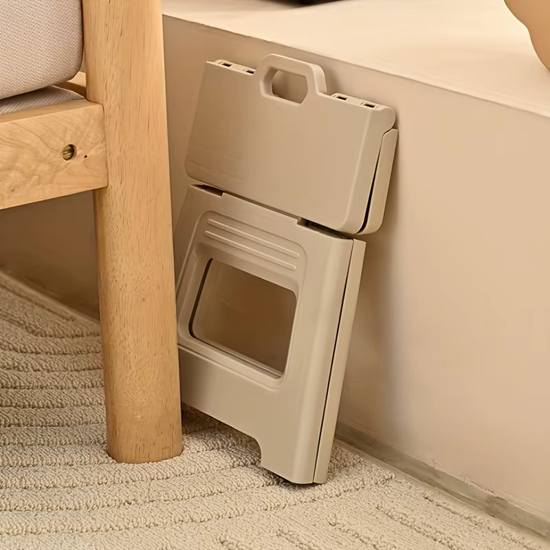 Taburete plegable portátil en uso exterior