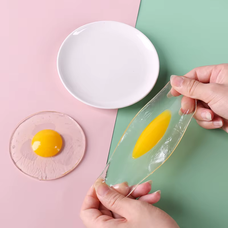 Funky Egg Splat Ball pelota antiestrés huevo estrujable para niños - imagen 3