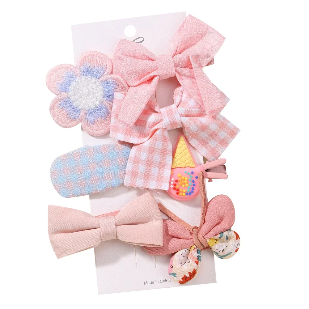 Conjunto de lazos florales y horquillas para niña