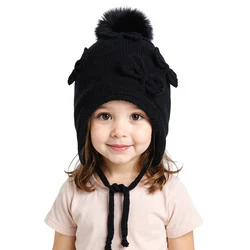 Gorro con orejeras tejido cálido, lazo y pompón para invierno