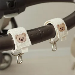 Gancho para cochecito con oso bordado – Colgador universal de bolsas