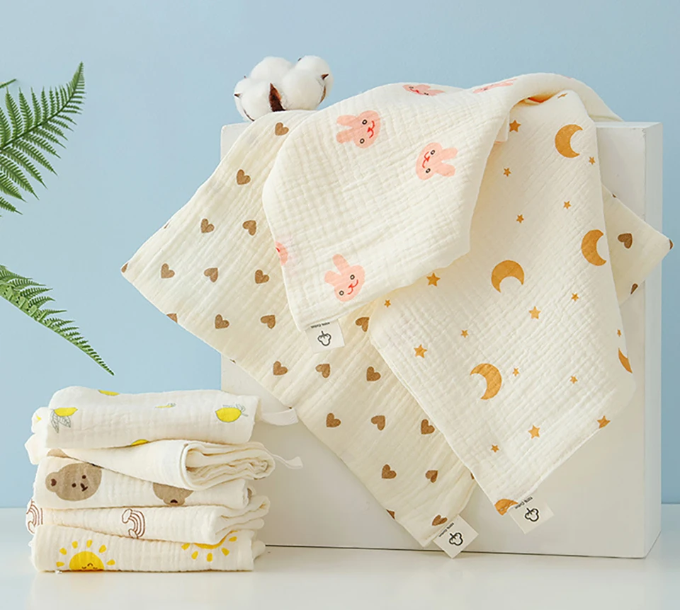 Baberos de algodón con motivos infantiles