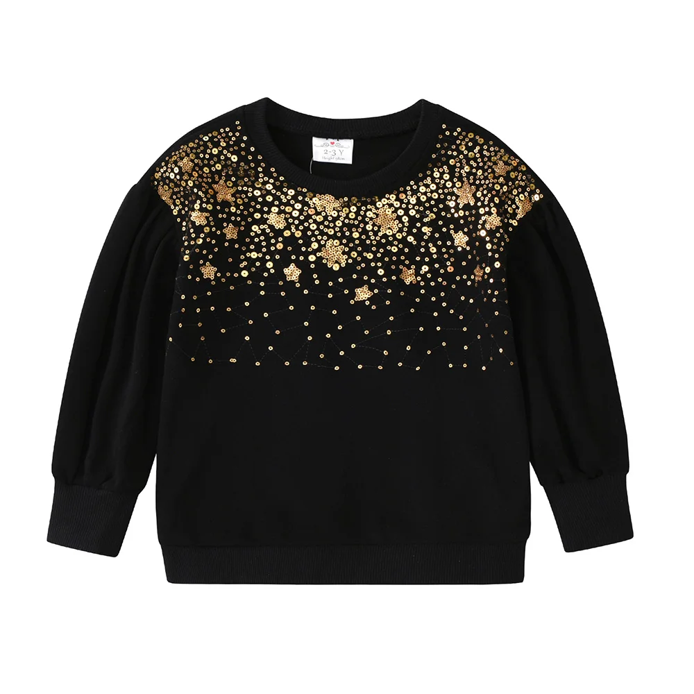 Apliques de lentejuelas y estrellas en la sudadera