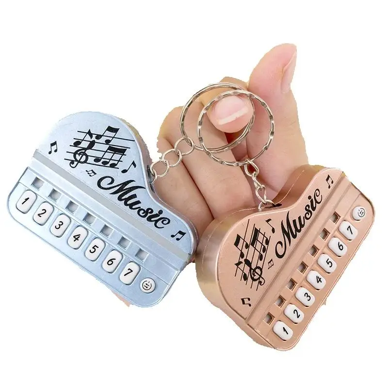 Teclado mini musical para llaves con colgante de piano