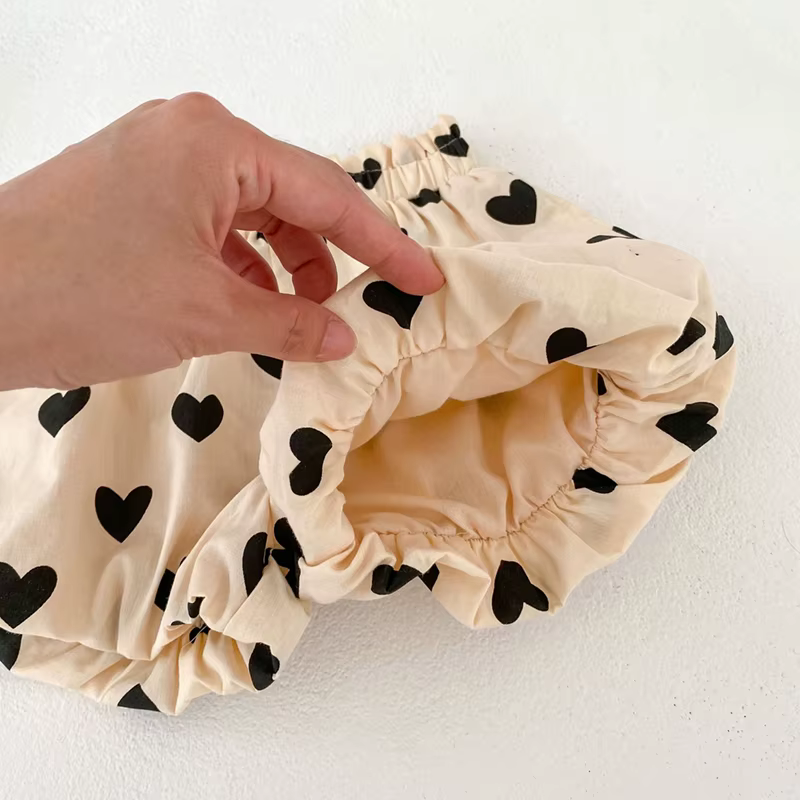 Conjunto bebé niña algodón con tirantes y corazón albaricoque
