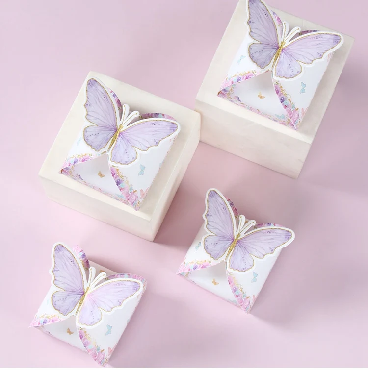 Variedad de estilos de cajas mariposa en tonos rosa y blanco