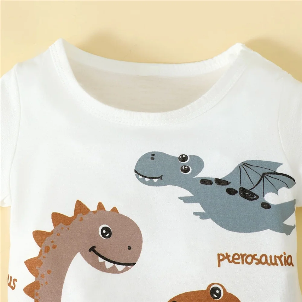 Conjunto deportivo bebé dinosaurios – Top blanco y pants marrón - imagen 3